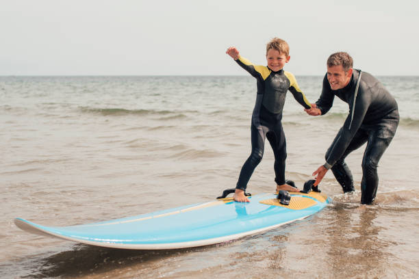 surfing-with-dad-at-the-beach